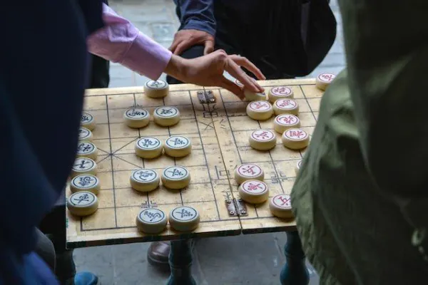 A picture of people playing xiangqi